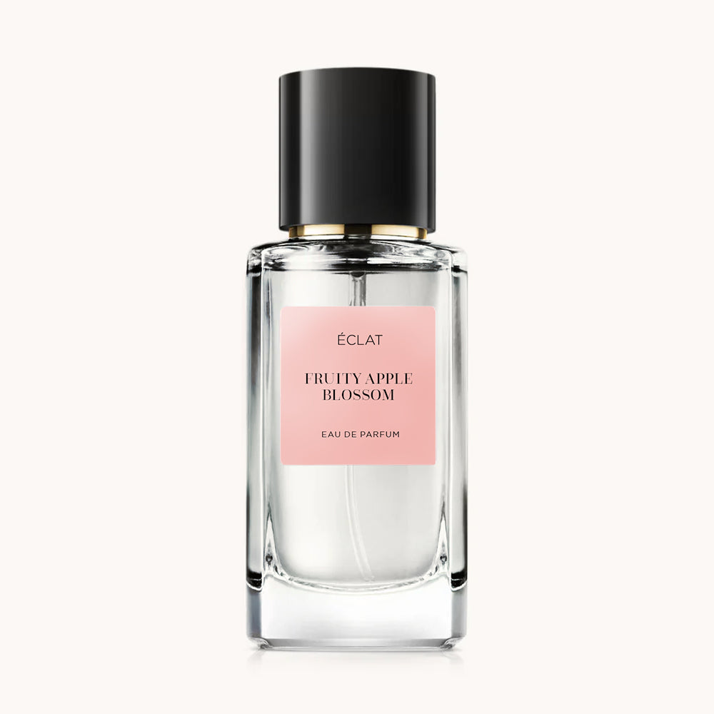 Flacon of the women’s perfume dupe ÉCLAT Fruity Apple Blossom RAR, an elegant transparent glass bottle with a black cylindrical magnetic cap and a dark pink label. The label displays the brand name ÉCLAT, the name Fruity Apple Blossom RAR, and the phrase “Eau de Parfum”.