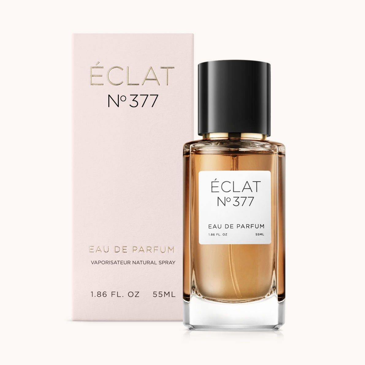 ÉCLAT No. 377 perfume bottle with matching light pink packaging. The elegant glass flacon features a black cylindrical magnetic cap and a simple white label with the inscription ÉCLAT No. 377 and “Eau de Parfum”.