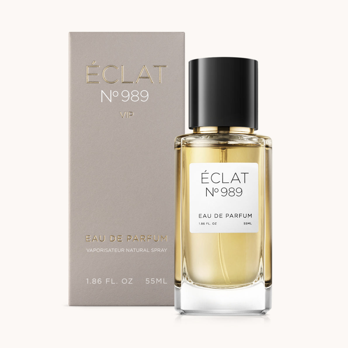 Flacon of the unisex perfume dupe ÉCLAT No. 989 VIP, an elegant transparent glass bottle with a black cylindrical magnetic cap and a minimalist white label. The label displays the brand name ÉCLAT, the number 989 VIP, and the phrase “Eau de Parfum”.