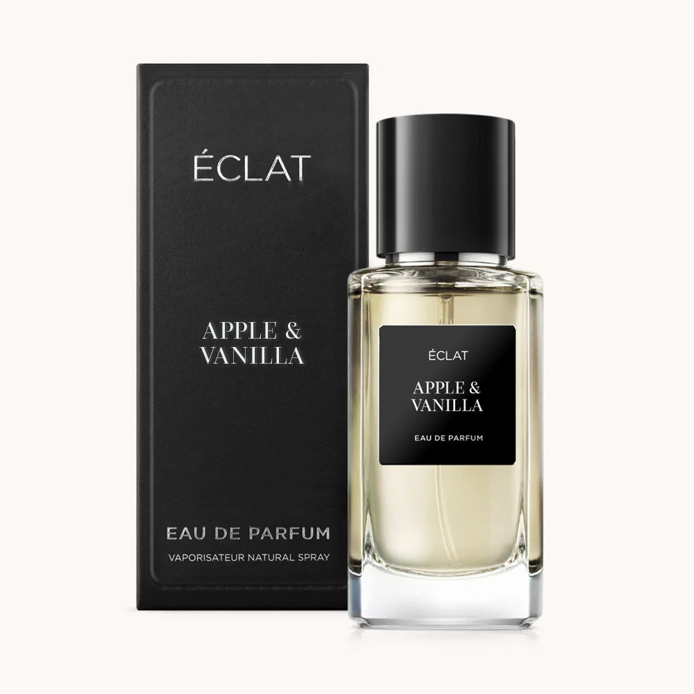 ÉCLAT Apple & Vanilla präsentiert einen schlanken Glasflakon mit schwarzem Etikett, begleitet von einer eleganten passenden Box.
