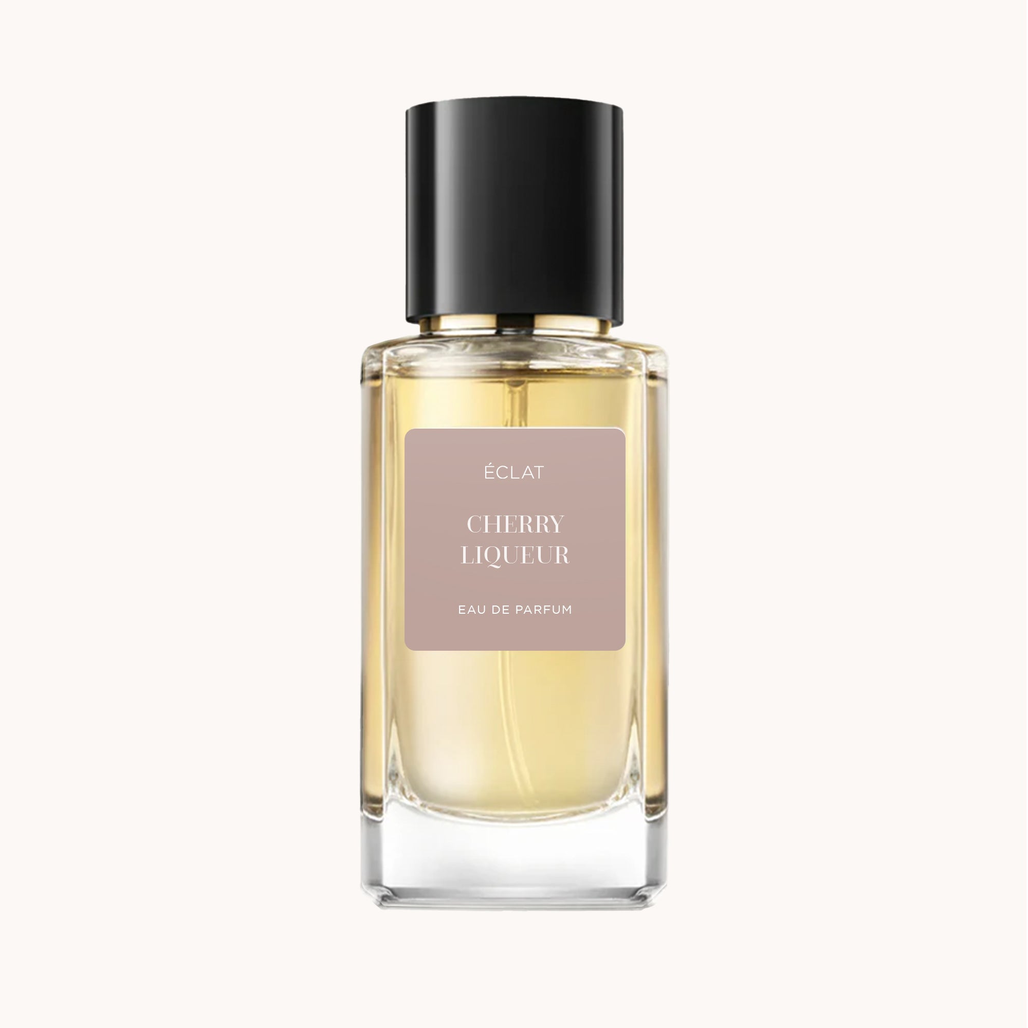 ÉCLAT Cherry Liqueur in einem klaren Glasflakon mit schwarzem Verschluss und einem sanft rosa Etikett.