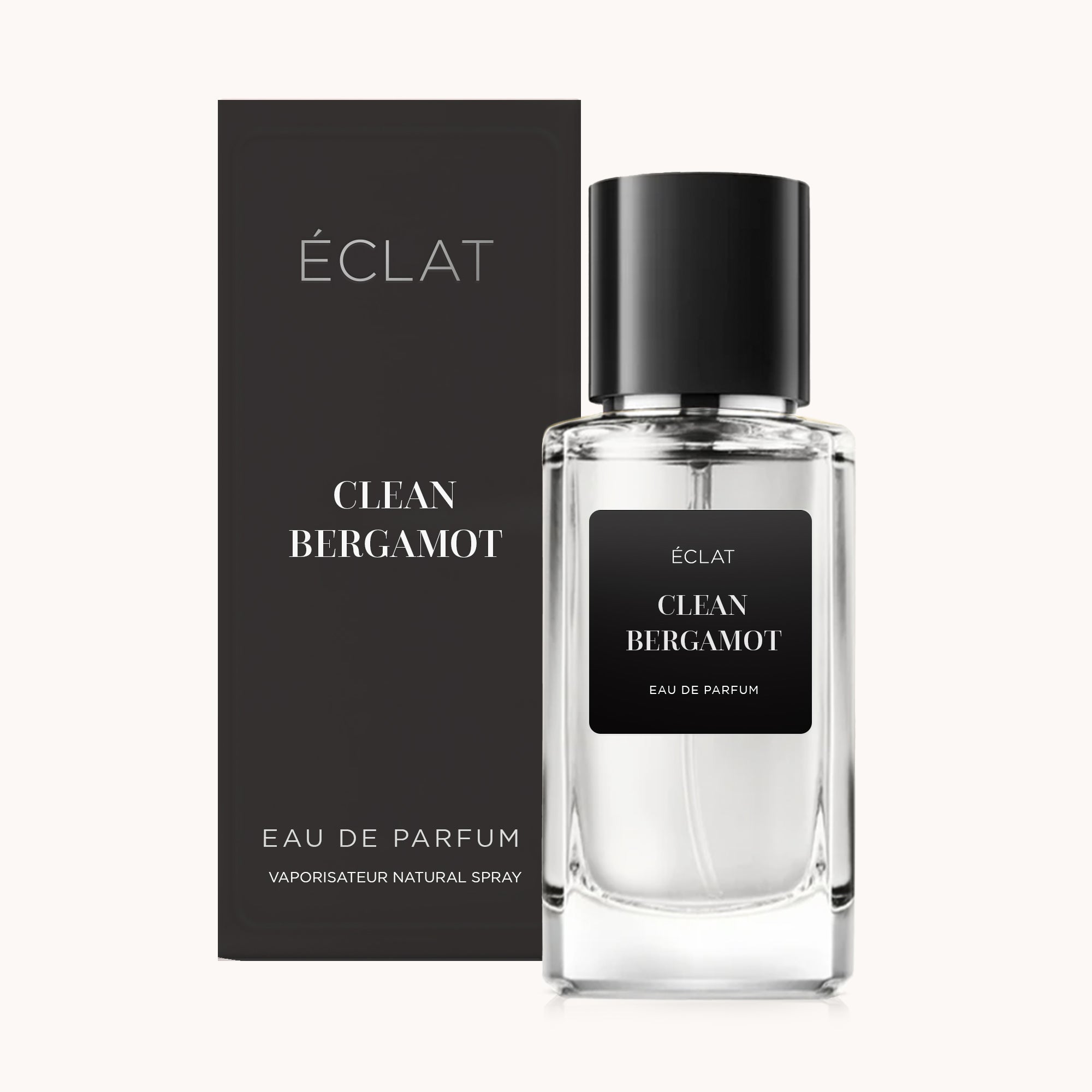 Erlesener Glasflakon mit schwarzem Etikett und passendem schwarzen Verschluss, neben der elegant gestalteten Box in mattem Schwarz, präsentiert ÉCLAT Clean Bergamot.