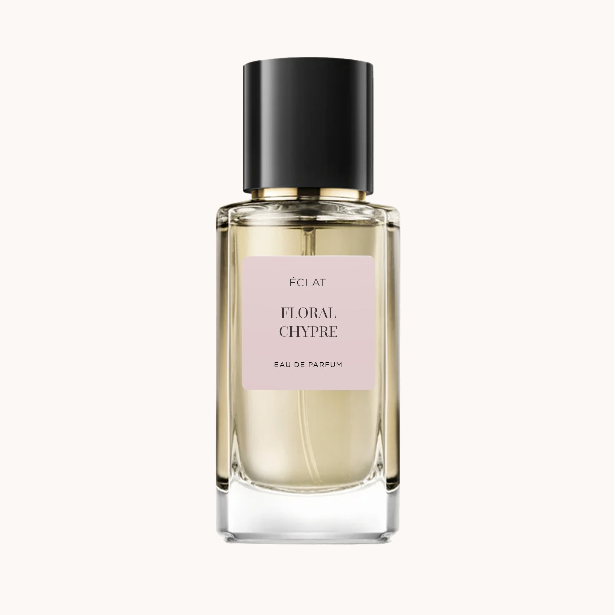 Der ÉCLAT Floral Chypre Parfumflakon besticht durch ein transparentes Glasdesign mit einem blassrosa Etikett und einem eleganten schwarzen Verschluss.