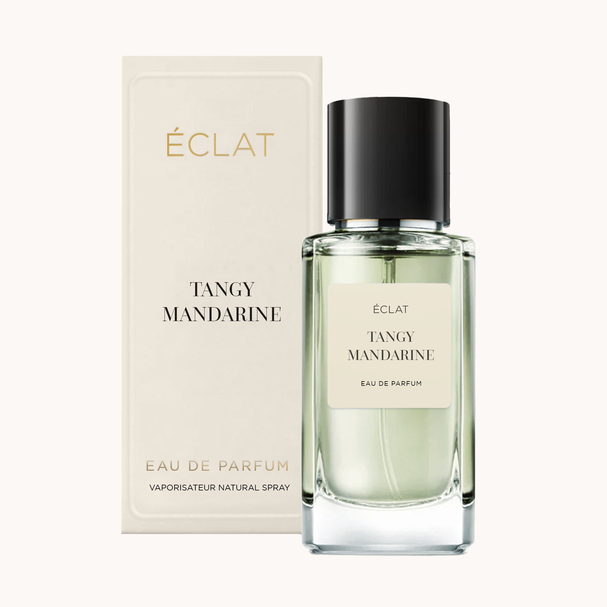 Facettierter Glasflakon von ÉCLAT Tangy Mandarin mit schwarzem Verschluss, neben seiner eleganten cremefarbenen Box.