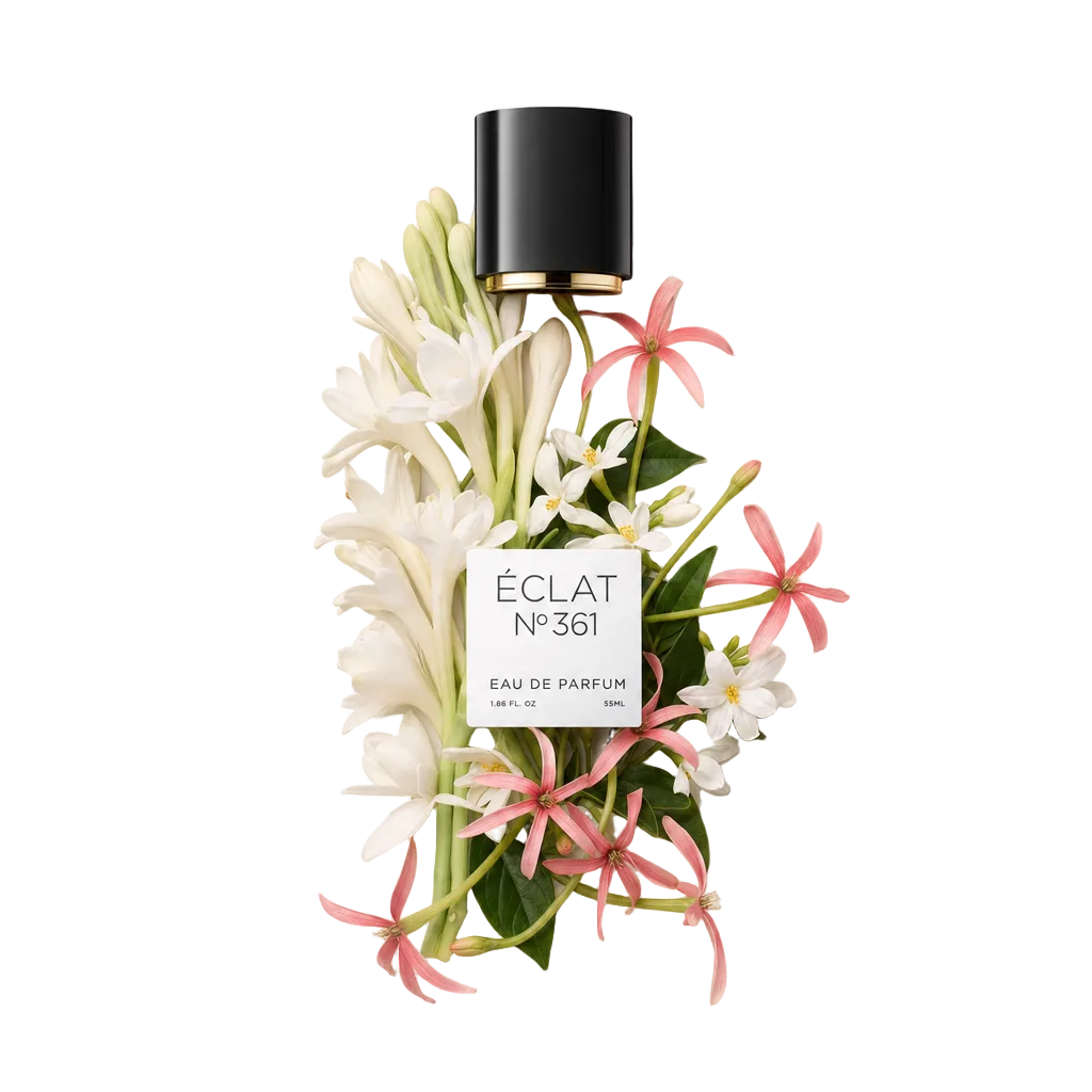 Ein Arrangement aus weißen Tuberosen und rosa Jasminblüten umrahmt eine schwarze Kappe mit dem ÉCLAT Tuberose & Jasmine Etikett.