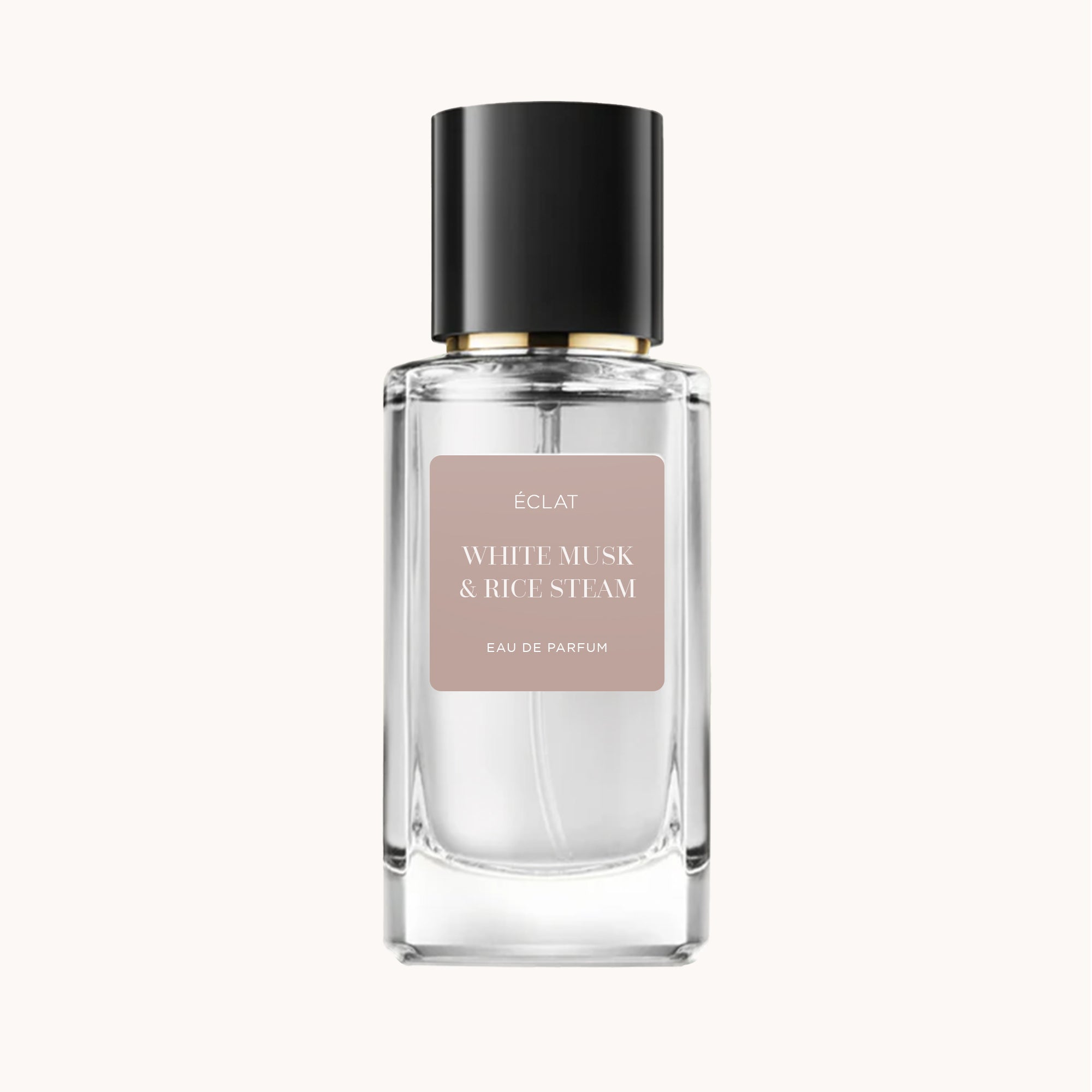 Facettierter Glasflakon von ÉCLAT White Musk & Rice Steam mit schwarzem Verschluss und mattem Etikett.