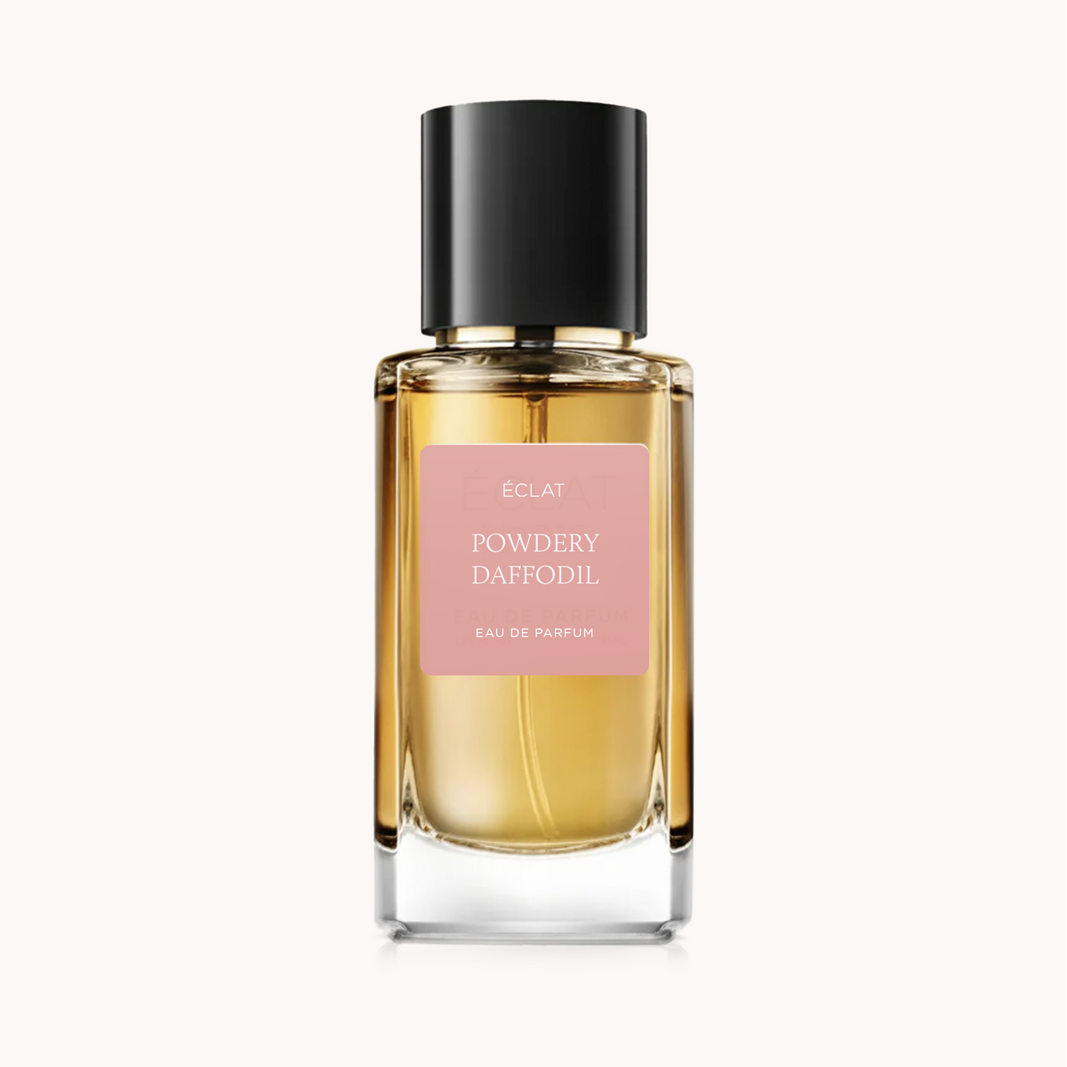 ÉCLAT Powdery Daffodil in einem facettierten Glasflakon mit schwarzer Kappe und rosa mattem Etikett.