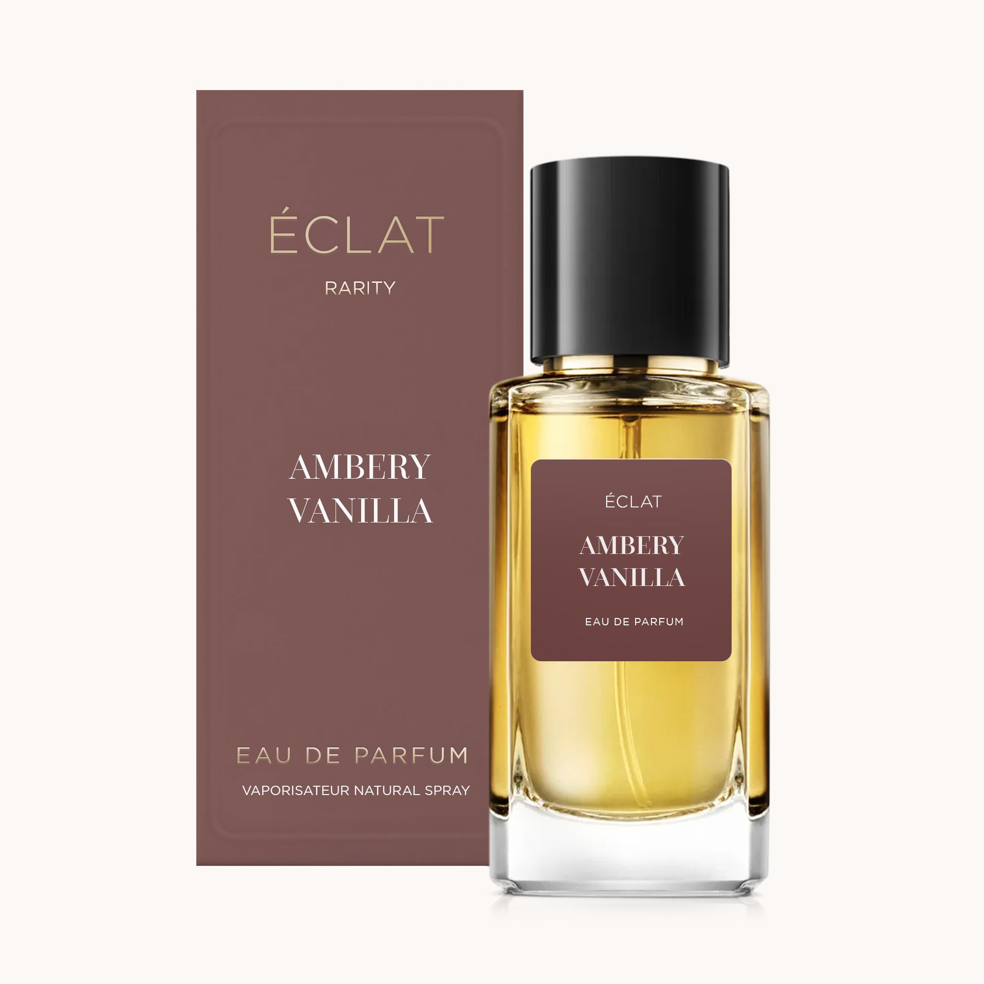 ÉCLAT Ambery Vanilla in einem facettierten Glasflakon mit schwarzem Verschluss, vor einer passenden eleganten Box platziert.