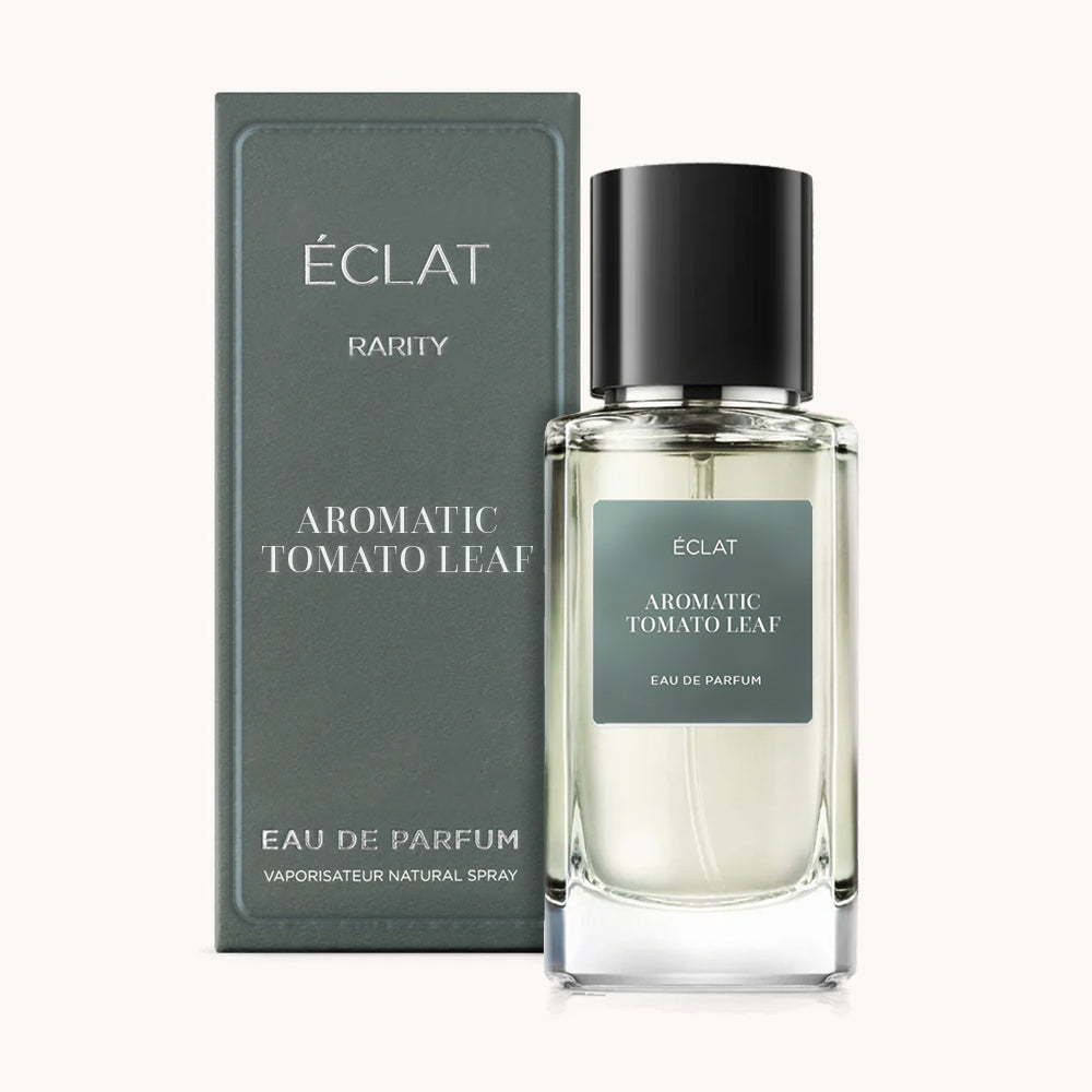 ÉCLAT Aromatic Tomato Leaf Parfumflakon mit dunkelgrünem Etikett und schwarzer Kappe, neben passender Box.