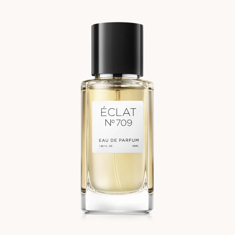 ÉCLAT RAR - Black Tea & Cedar in einem klaren Glasflakon mit schwarzem Verschluss und weißem Etikett.
