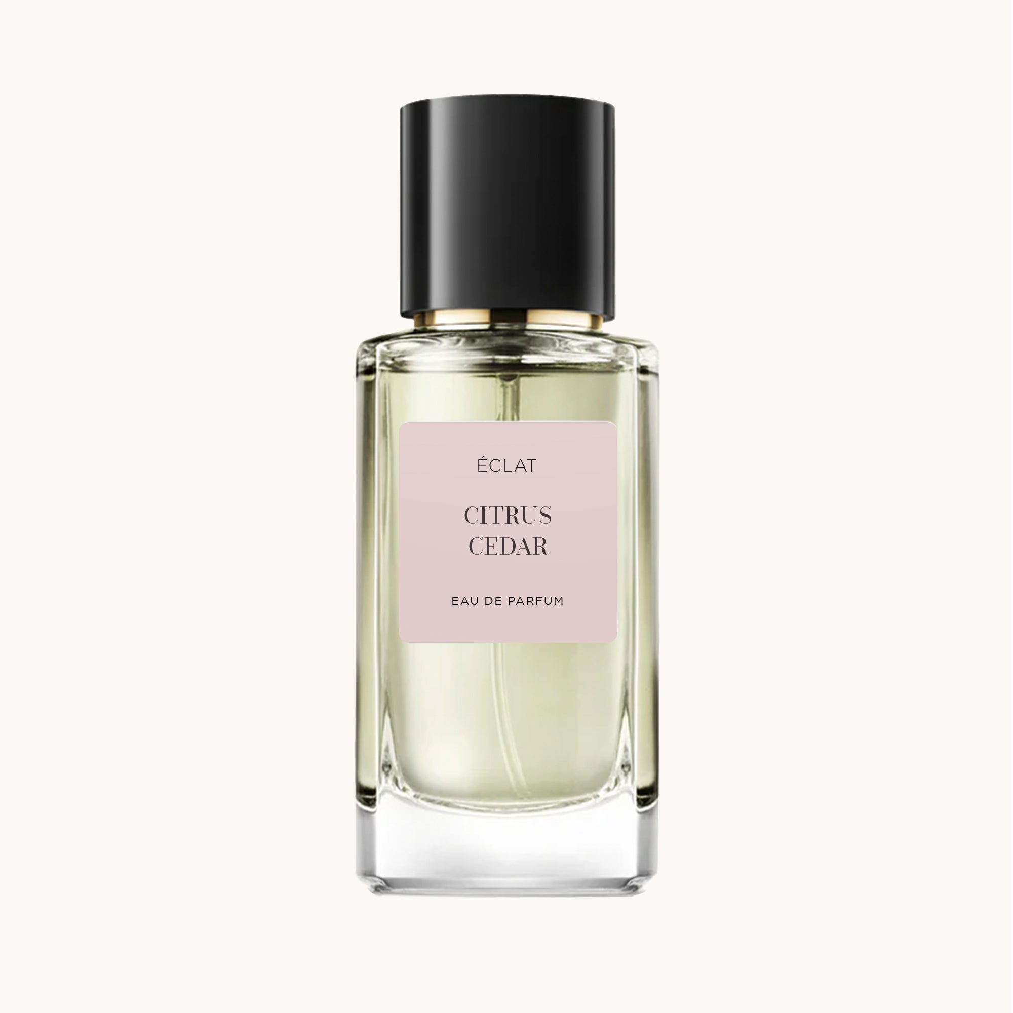 ÉCLAT Citrus Cedar in einem facettierten Glasflakon mit schwarzer Kappe und pastellfarbenem Etikett in der Mitte.