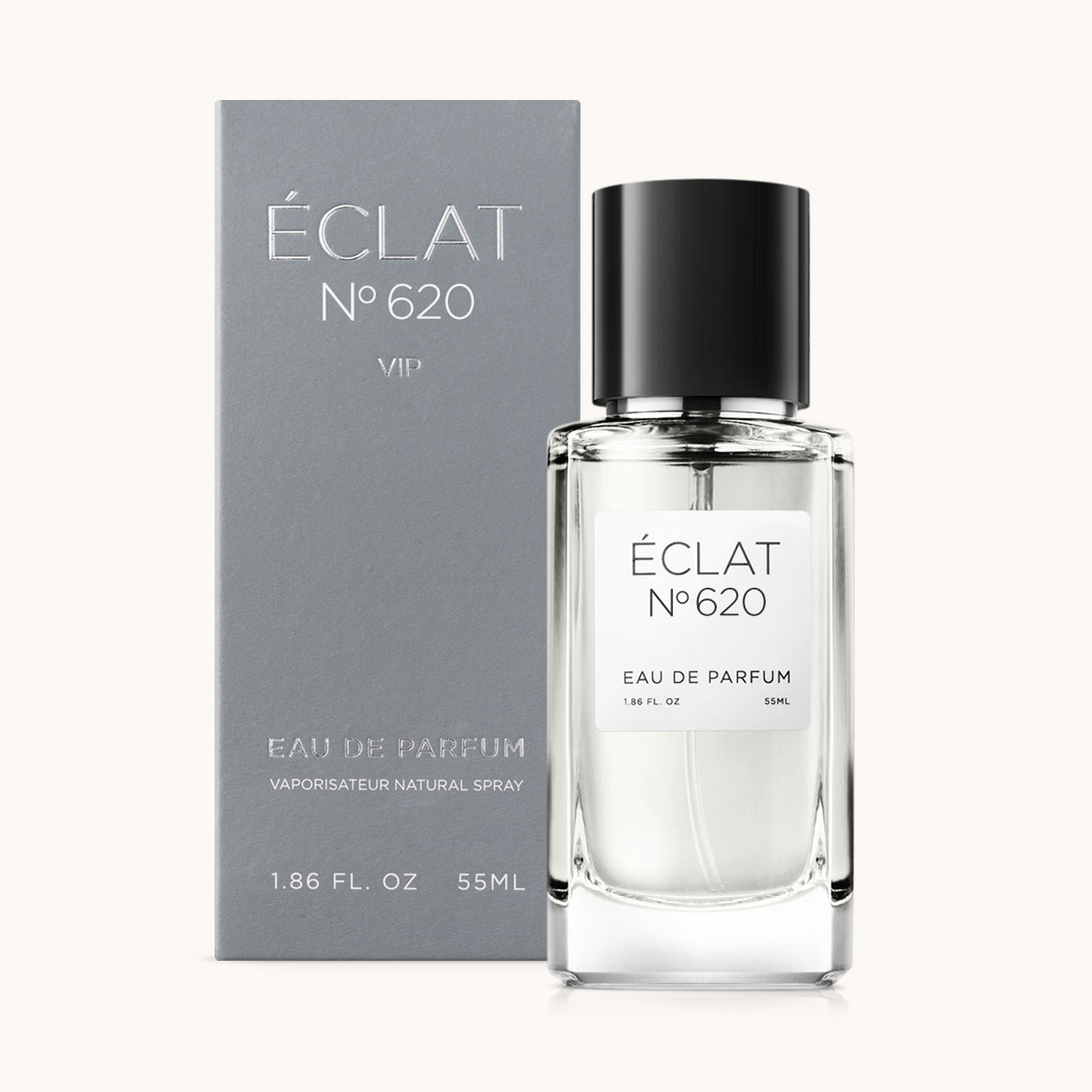 Das ÉCLAT Citrus Woods Parfum präsentiert sich in einem transparenten Glasflakon mit schwarzem Verschluss, begleitet von einer eleganten grauen Box.
