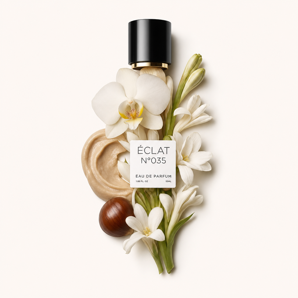 Eine Komposition aus cremiger Textur, weißen Tuberoseblüten und einer Orchidee umgibt eine schwarze Kappe mit Etikett für ÉCLAT Creamy Tuberose.