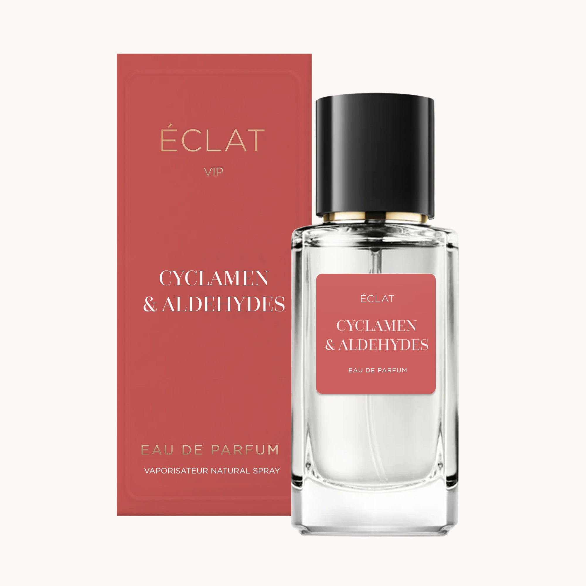 Ein facettierter Glasflakon mit mattem Etikett von ÉCLAT Cyclamen & Aldehydes, kombiniert mit einer passenden roten Box.
