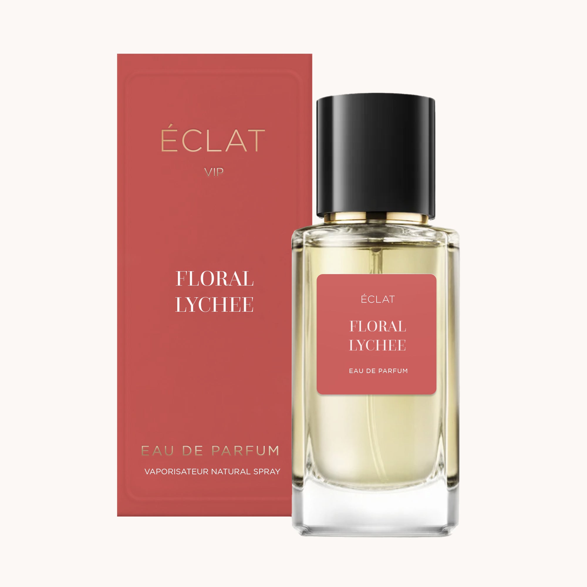 Ein facettierter Glasflakon ÉCLAT Floral Lychee mit schwarzem Verschluss, begleitet von einer korallenfarbenen Box, die aufrecht steht.
