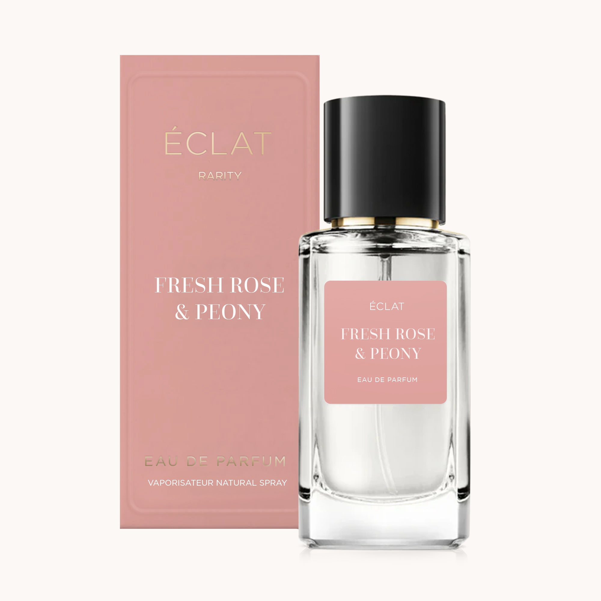 ÉCLAT Fresh Rose & Peony Parfümflakon aus klarem Glas mit schwarzem Verschluss neben passender rosa Box.
