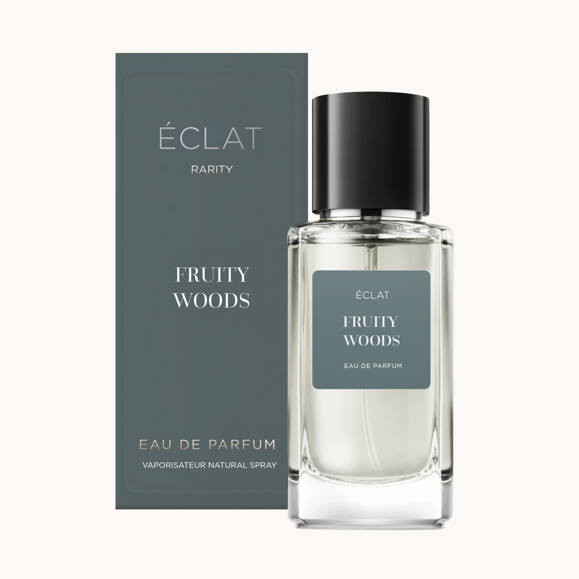ÉCLAT Fruity Woods Duftflakon neben seiner eleganten dunkelgrünen Verpackung.