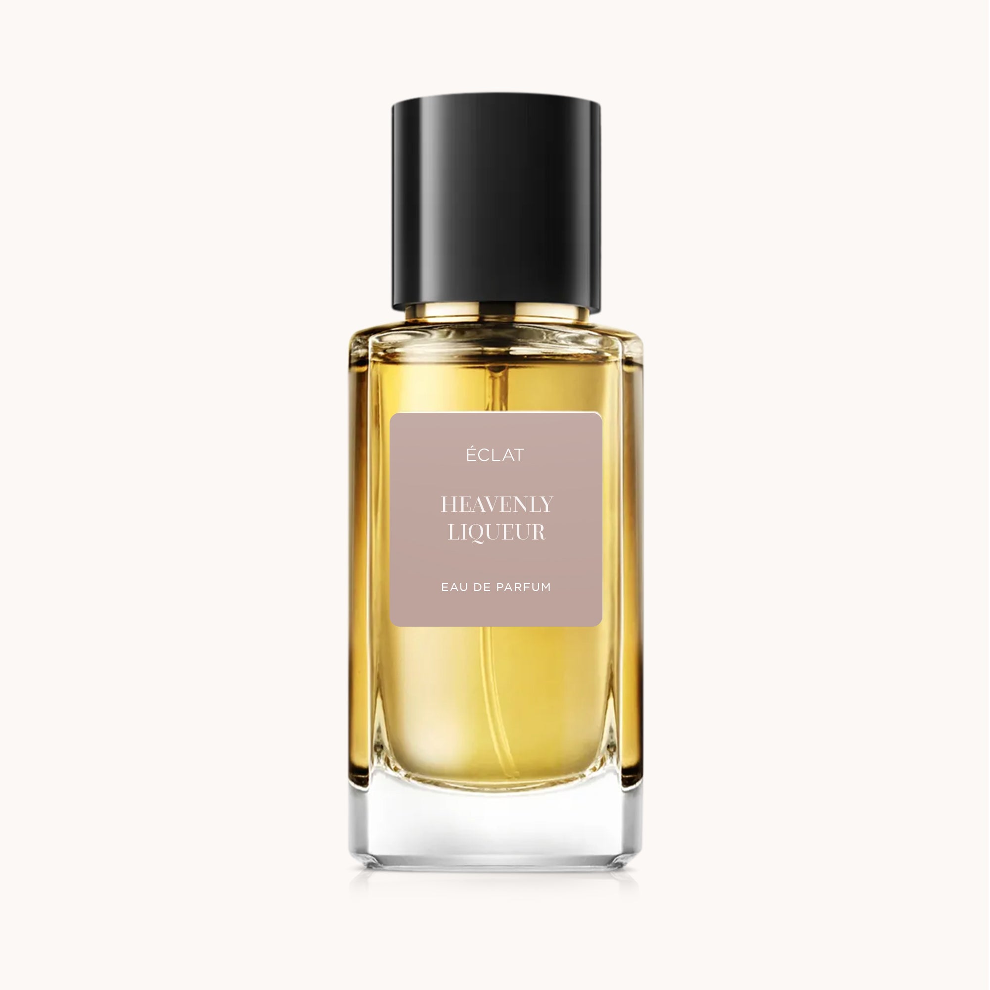 Facettierter Glasflakon von ÉCLAT Heavenly Liqueur mit eleganter schwarzer Kappe und zurückhaltendem Etikett.
