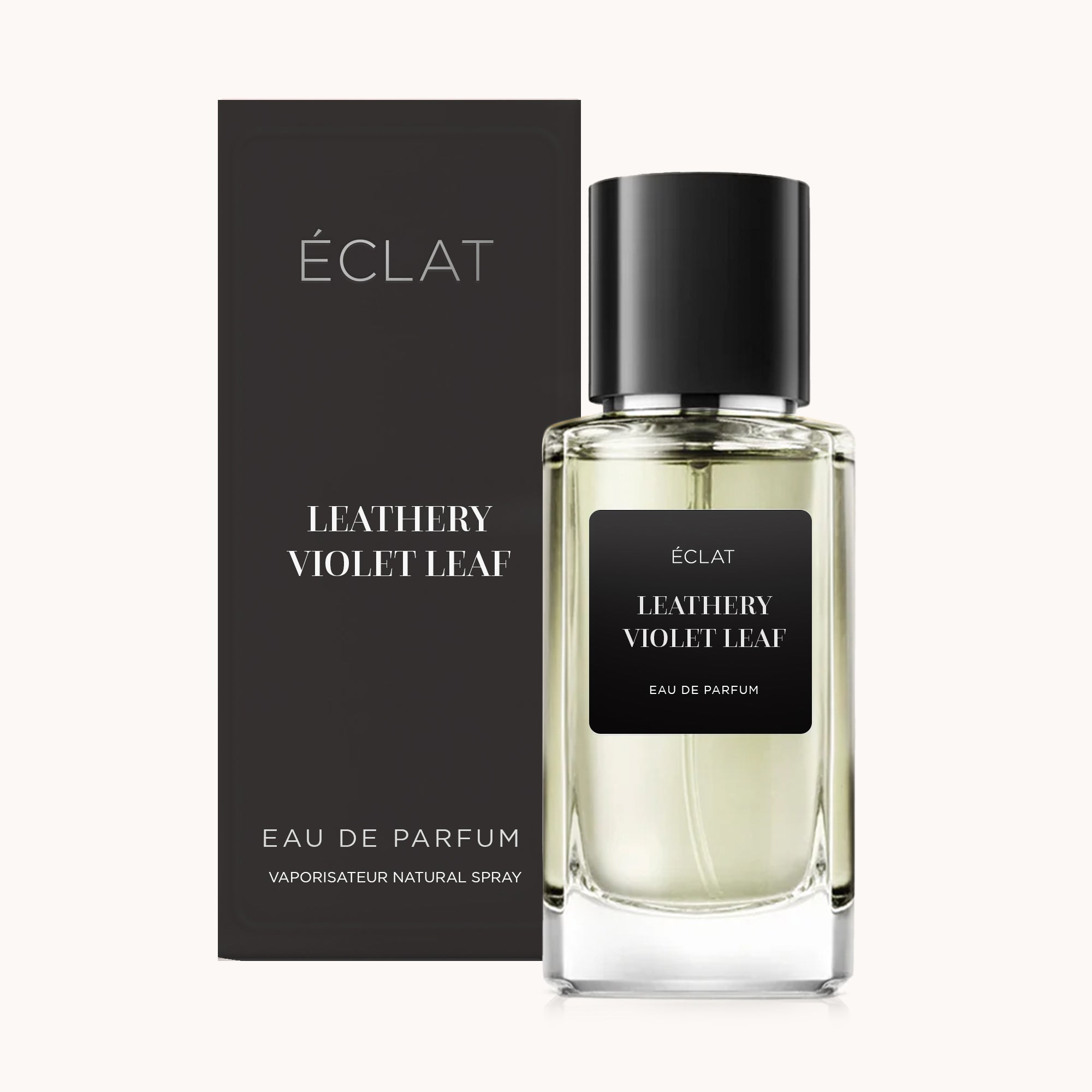 Das ÉCLAT Leathery Violet Leaf Parfum in einem klaren Glasflakon mit schwarzem Etikett und passender schwarzer Kappe, begleitet von einer eleganten schwarzen Box.