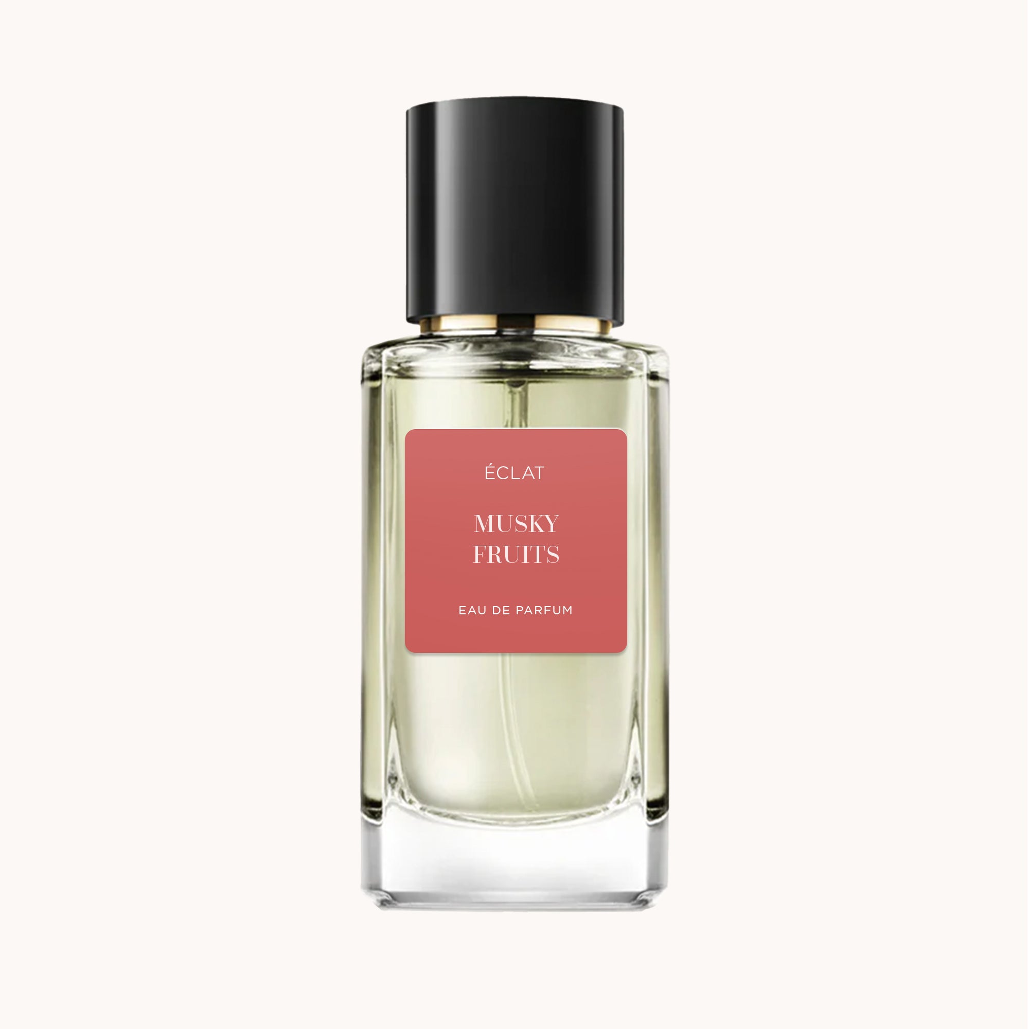 ÉCLAT Musky Fruits in einem facettierten Glasflakon mit schwarzer Kappe und mattem rosa Etikett.