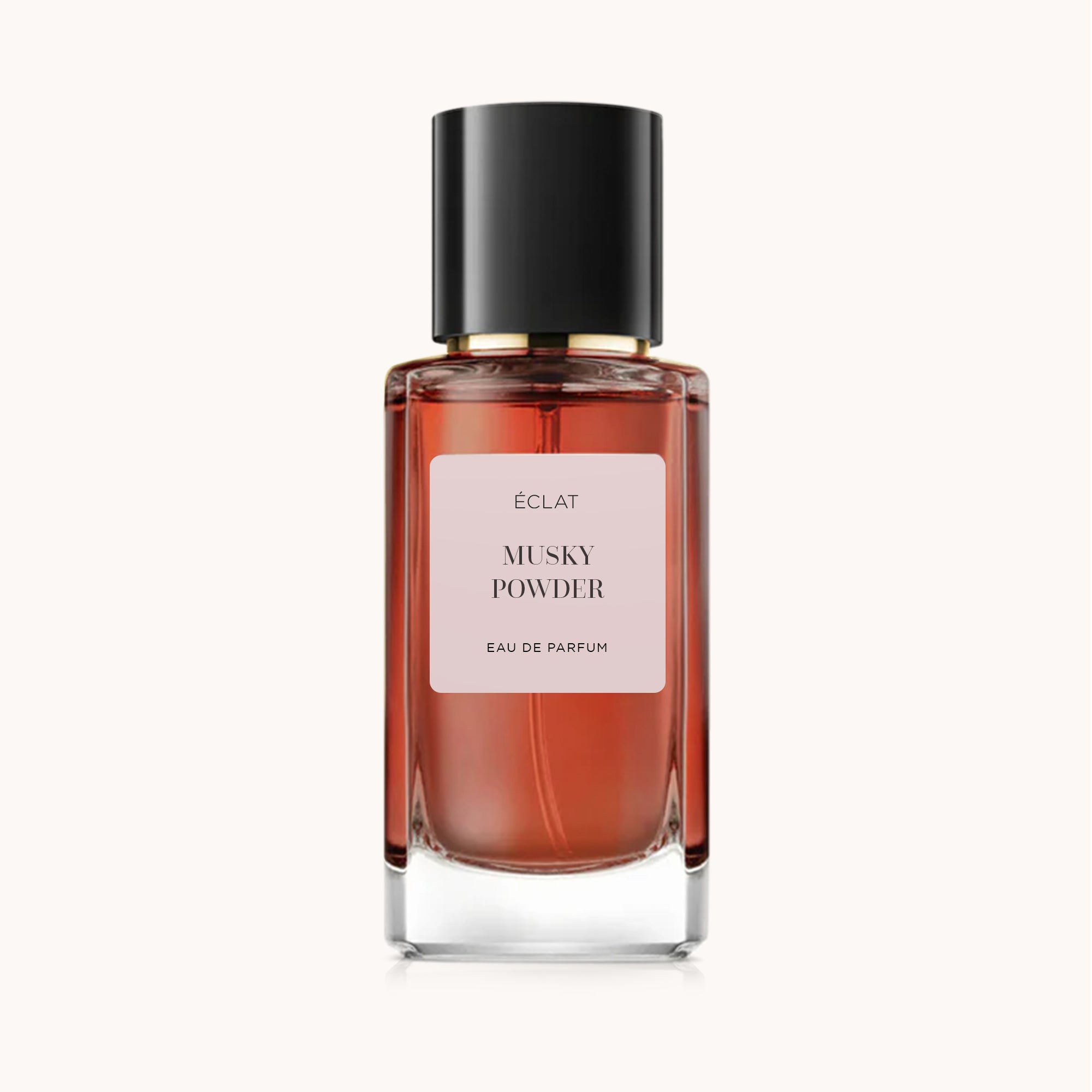 Facettierter Glasflakon von ÉCLAT Musky Powder mit schwarzem Verschluss und rosa Etikett.