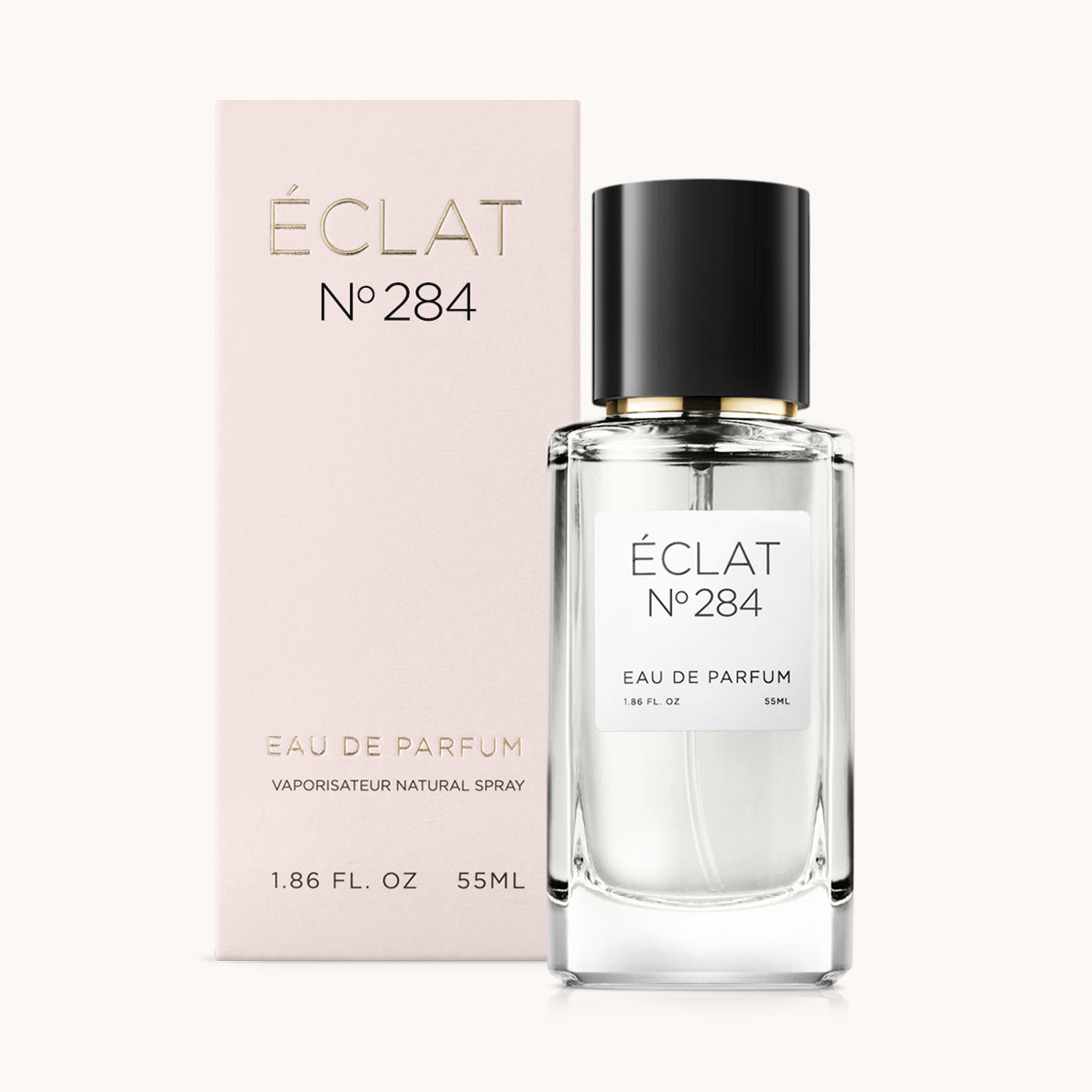 Facettierter Glasflakon von ÉCLAT Musky Rose mit schwarzer Kappe, neben einer rosafarbenen Schachtel.