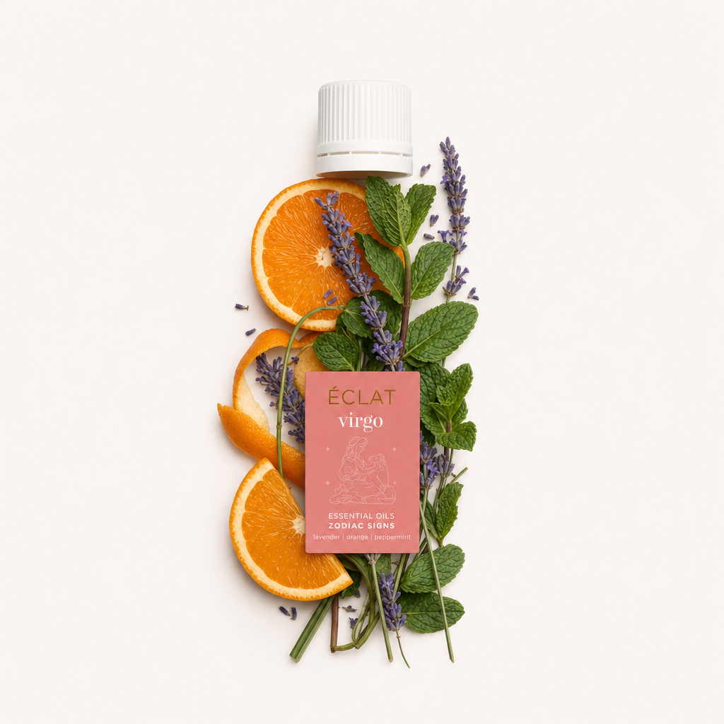 Ein harmonisches Arrangement aus Lavendelzweigen, Orangenscheiben und grünen Minzblättern umgibt eine schwarze Kappe mit ÉCLAT Virgo-Etikett.
