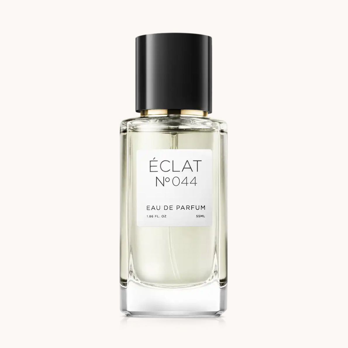 Ein facettierter Glasflakon von ÉCLAT VIP - Peach, Tuberose & Vanilla mit schwarzem Verschluss und weißem Etikett.