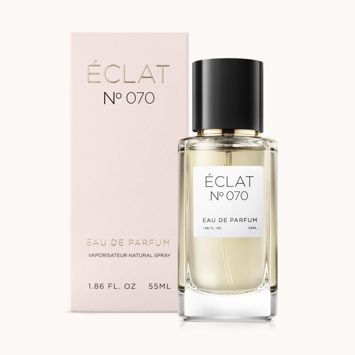 Ein facettierter Glasflakon von ÉCLAT Peony & Patchouli mit schwarzem Verschluss, neben einer rosa Box.