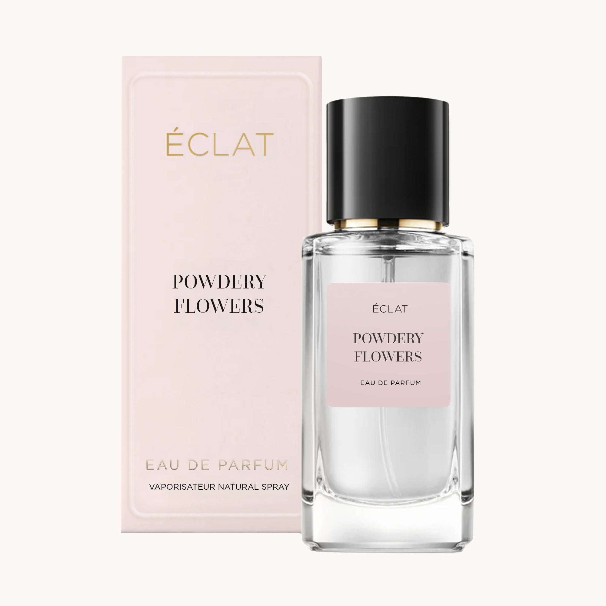 Facettierter Glasflakon von ÉCLAT Powdery Flowers mit schwarzer Kappe, neben einer blassrosa Verpackungsbox.