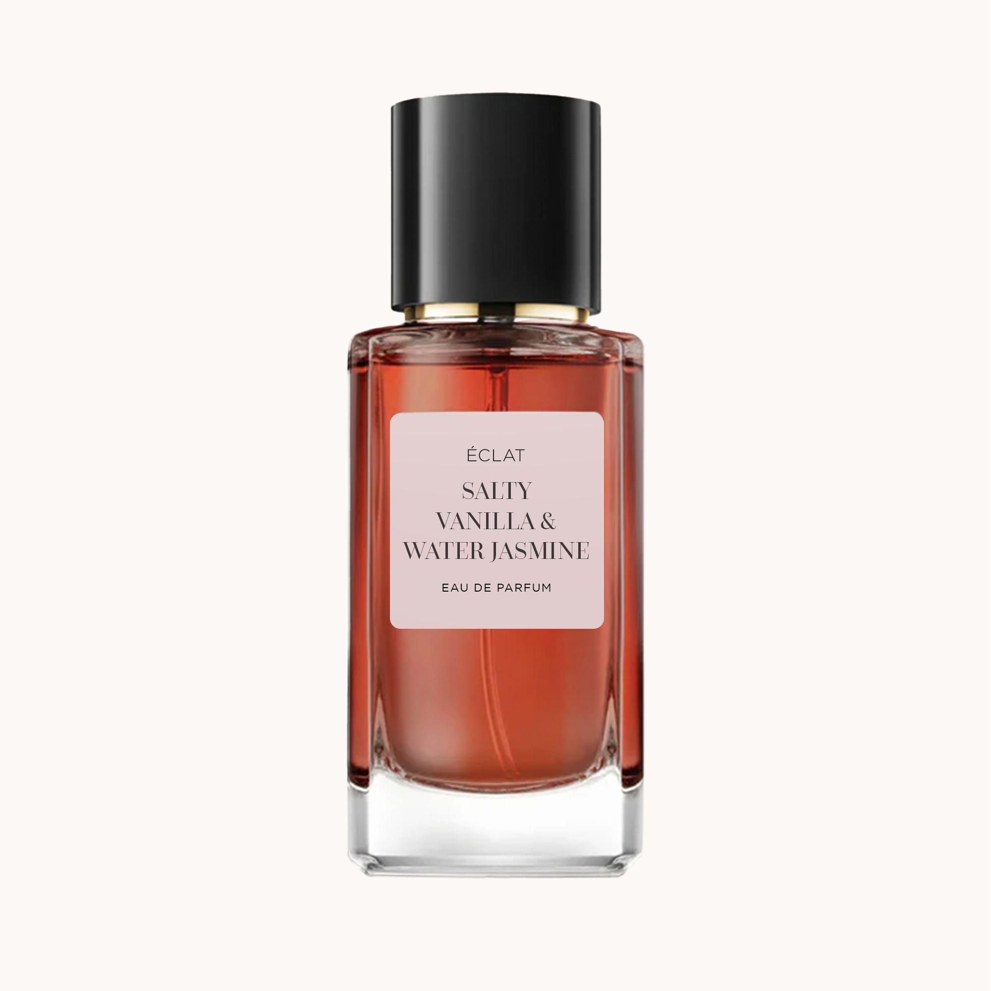 ÉCLAT Salty Vanilla & Water Jasmine in einem facettierten Glasflakon mit schwarzem Verschluss.