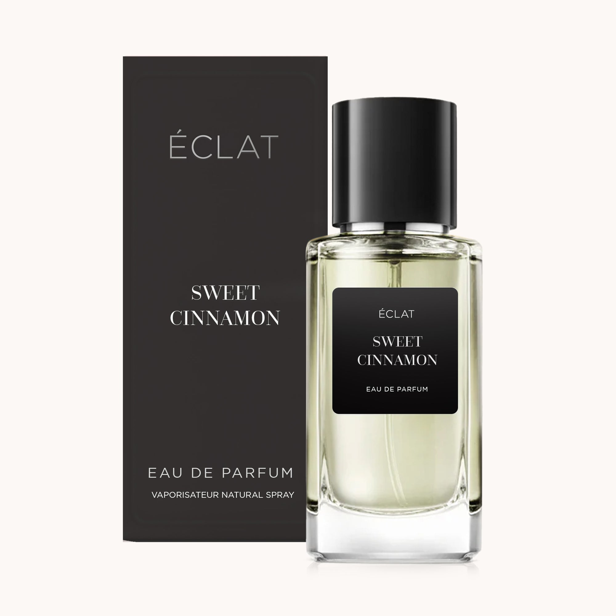 Glasflakon von ÉCLAT Sweet Cinnamon mit schwarzem Etikett und passender schwarzer Schachtel im Hintergrund.