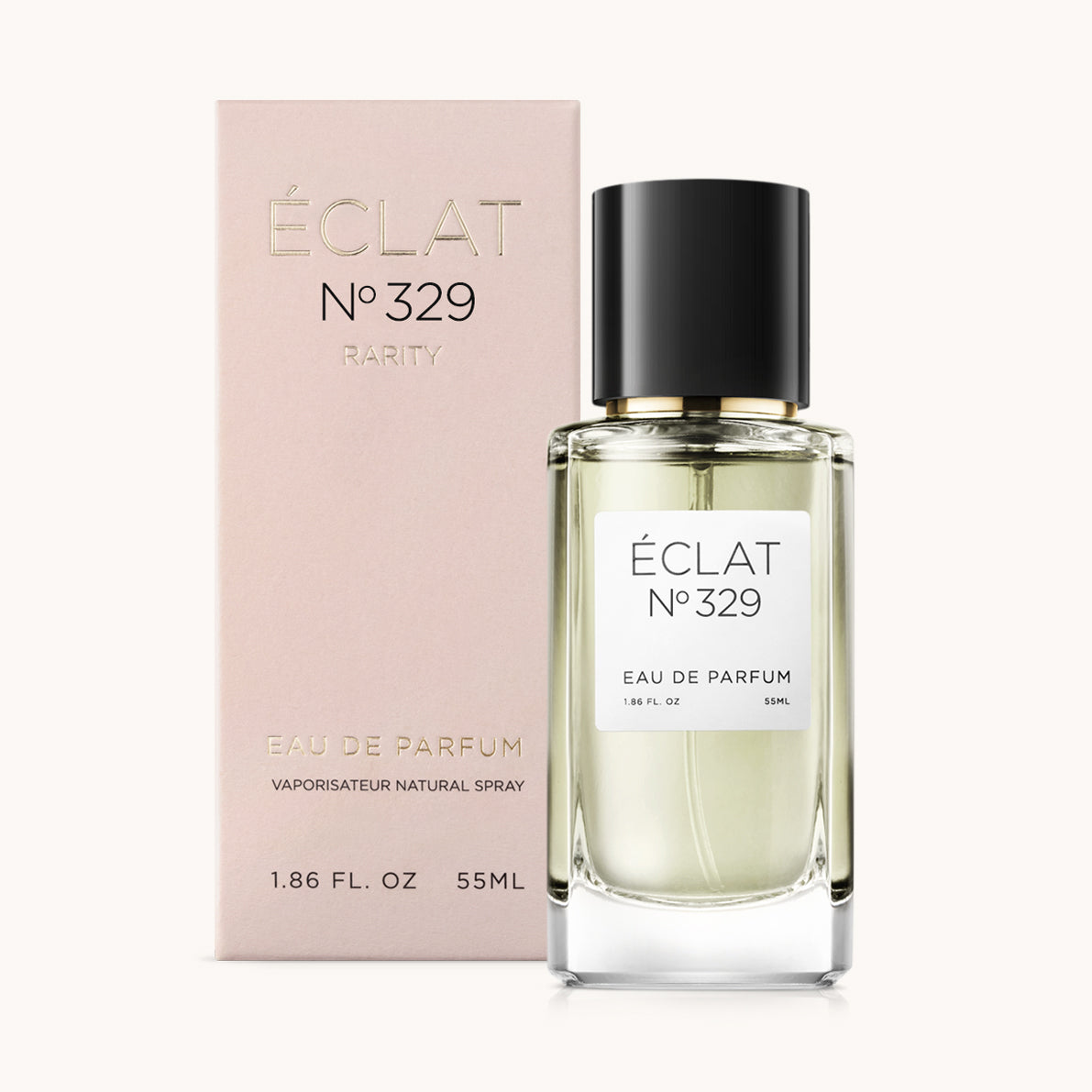 Ein facettierter Glasflakon von ÉCLAT Sweet Whipped Cream mit schwarzer Kappe, neben einer rosa Verpackung platziert.