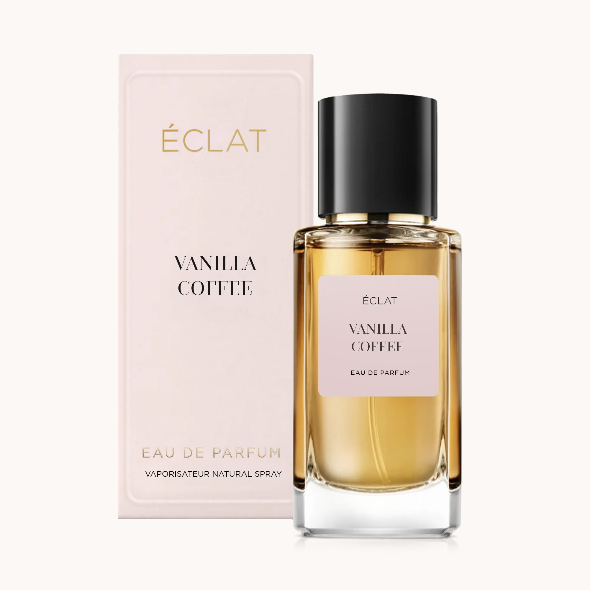 ÉCLAT Vanilla Coffee präsentiert sich in einem klaren Glasflakon mit schwarzem Verschluss, begleitet von einer eleganten rosa Box.